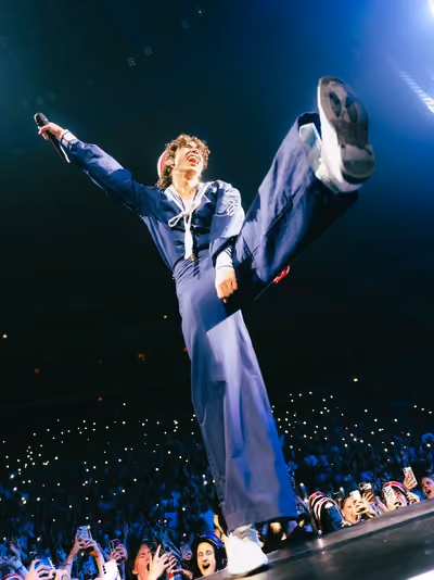 Performer mid-jump with motion blur on stage
